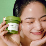 Woman holding Beplain Mung Bean Pore Clay Mask demonstrating skincare use