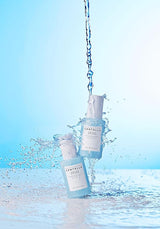 Lightweight blue serum texture applied on skin close up
